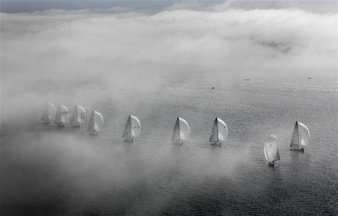 The Farr 40 fleet rolling through the fog under spinnaker ©  Rolex/Daniel Forster http://www.regattanews.com